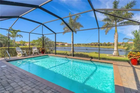 a view of a backyard with a swimming pool