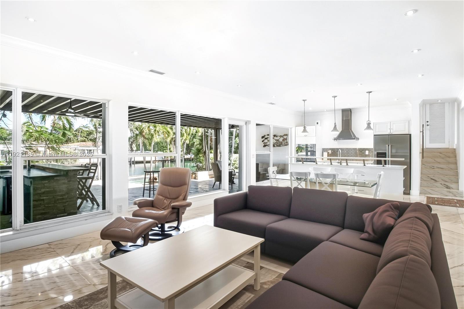 12545 Palm Road North Miami, FL 33181 - Photo 11 of 31 a living room with furniture and a large window