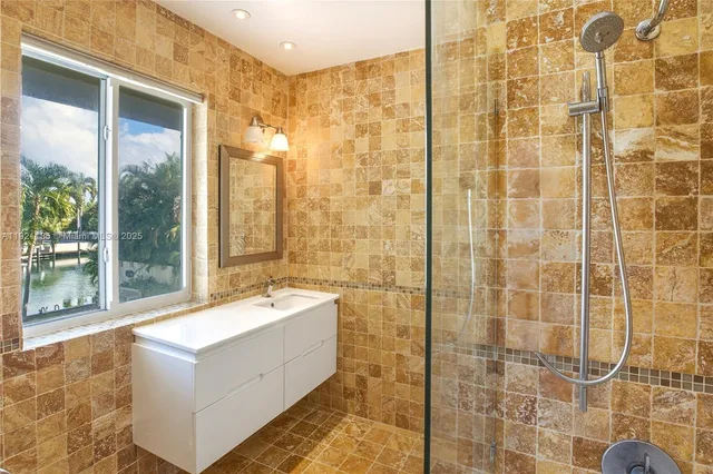 a bathroom with a bathtub and shower