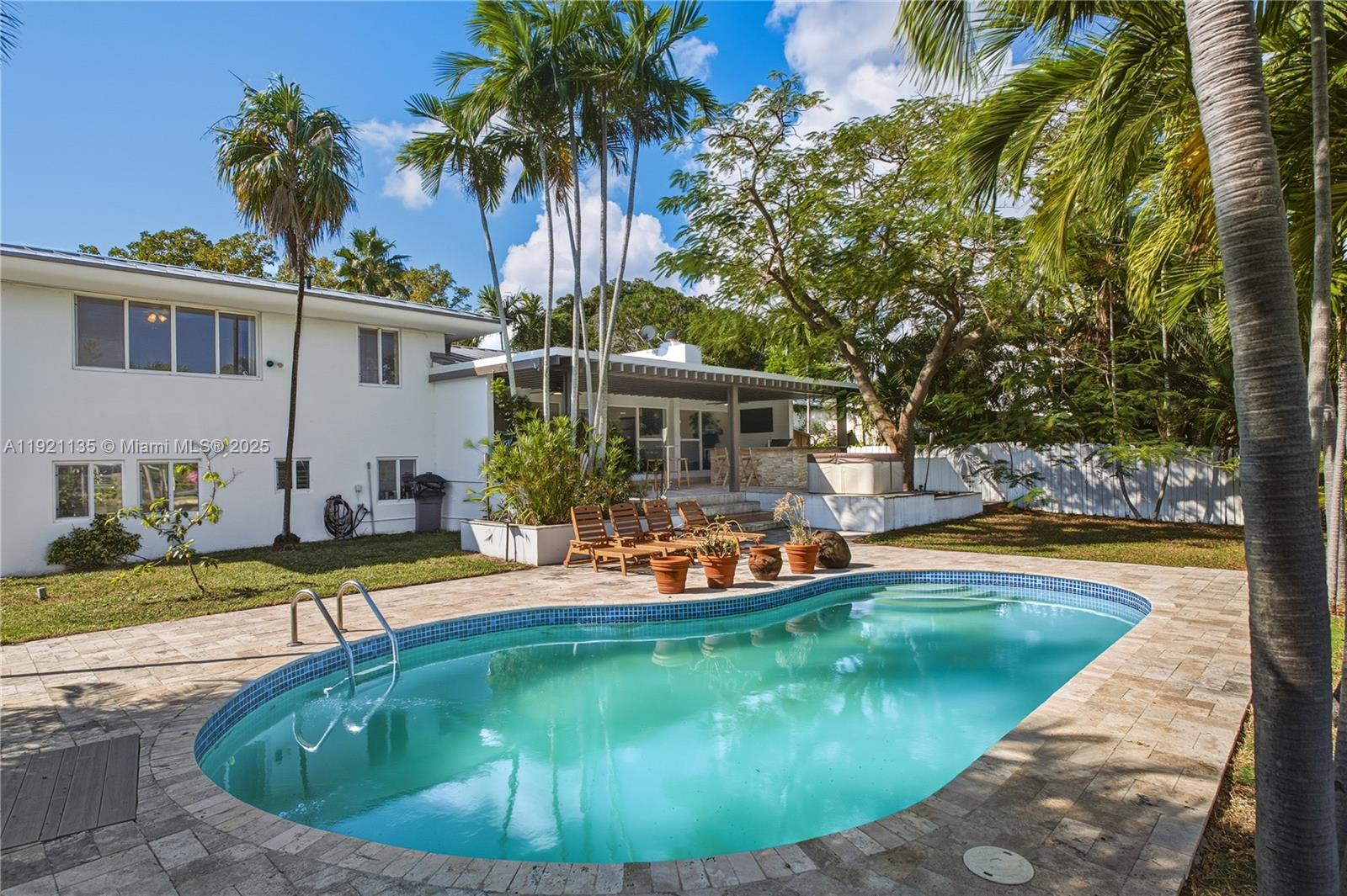 12545 Palm Road North Miami, FL 33181 - Photo 2 of 31 a view of a house with swimming pool