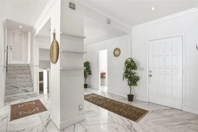 a bathroom with a potted plant and a shower