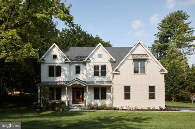 a view of house with yard and green space