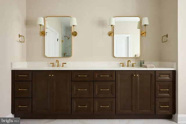 a bathroom with a double vanity sink and mirror