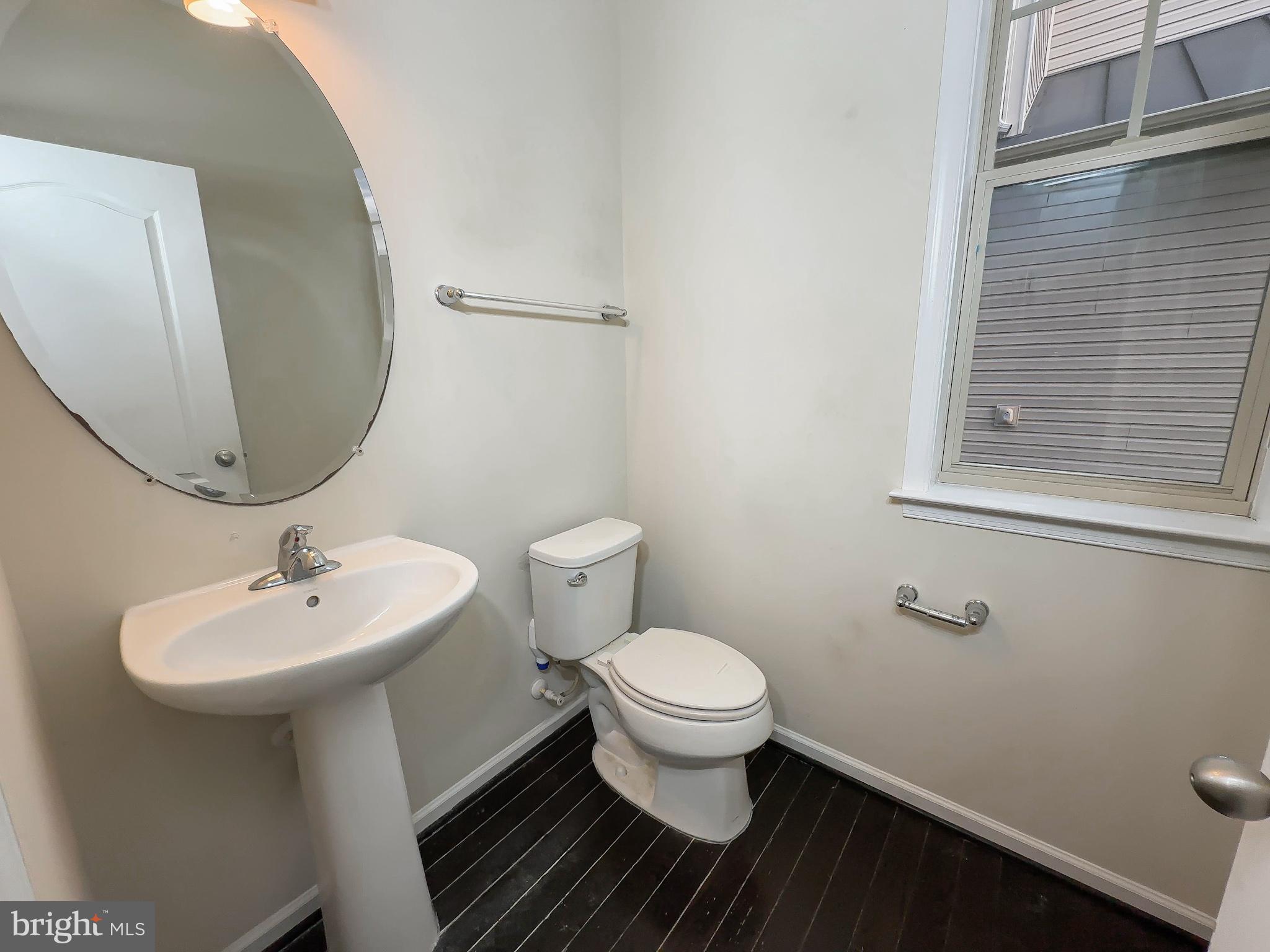 10202 Galaxy View Lane Lanham, MD 20706 - Photo 27 of 67 a bathroom with a sink toilet and a mirror