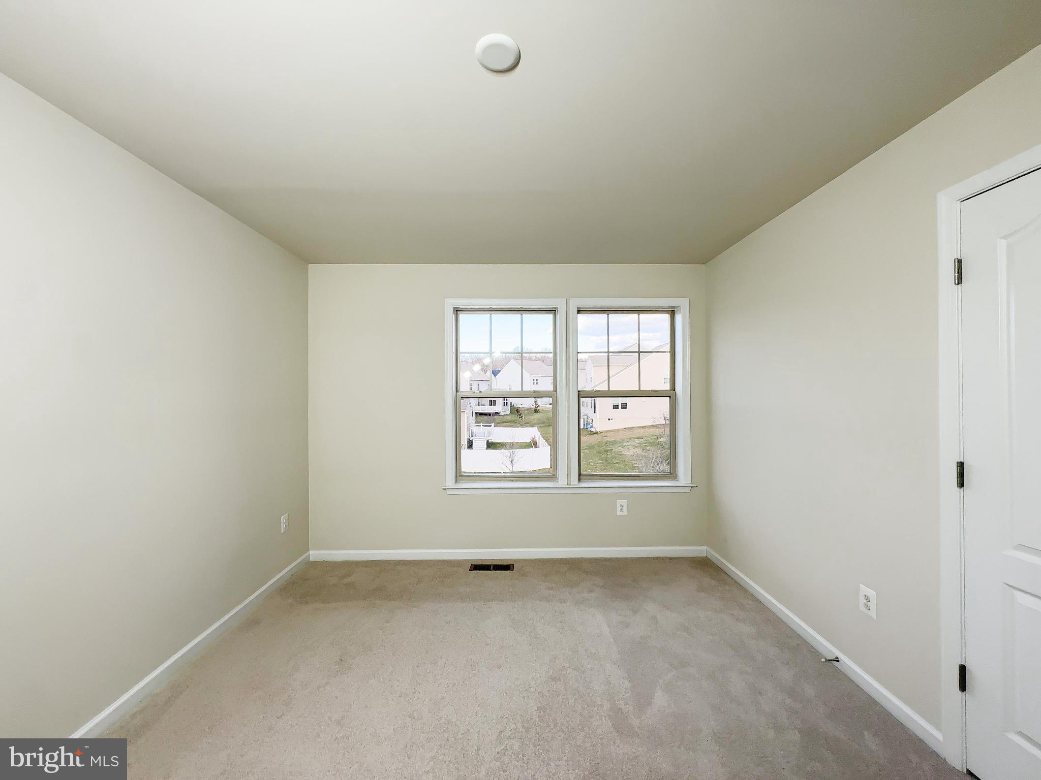10202 Galaxy View Lane Lanham, MD 20706 - Photo 31 of 67 an empty room with a window