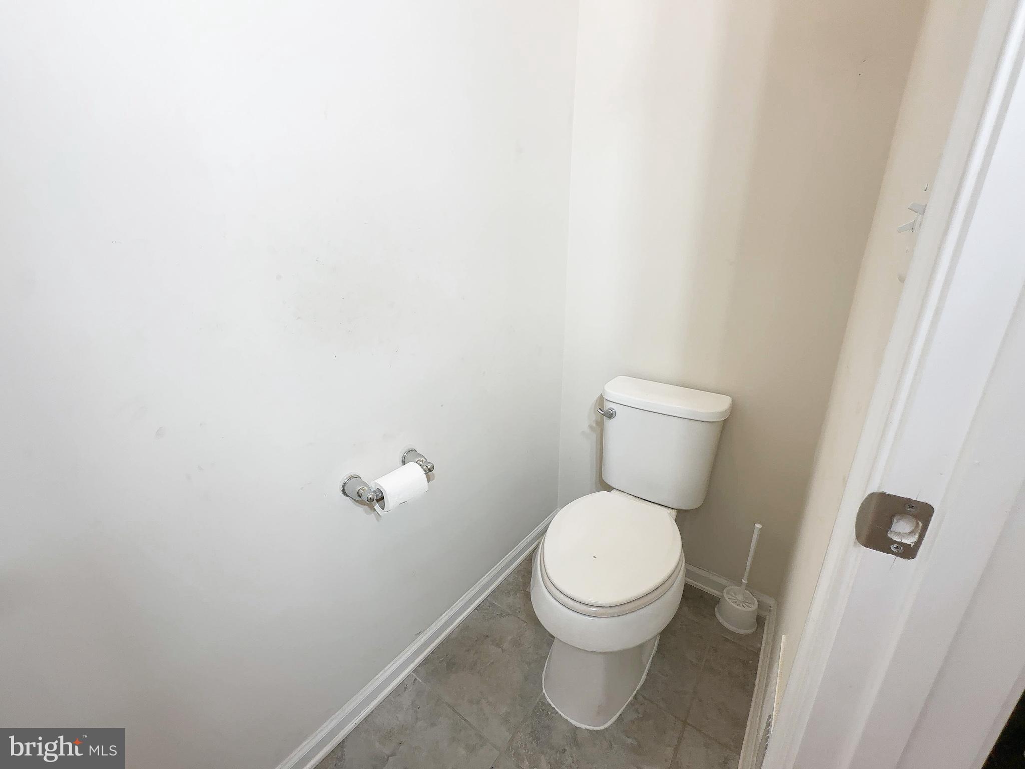 10202 Galaxy View Lane Lanham, MD 20706 - Photo 44 of 67 a white toilet sitting next to a white wall