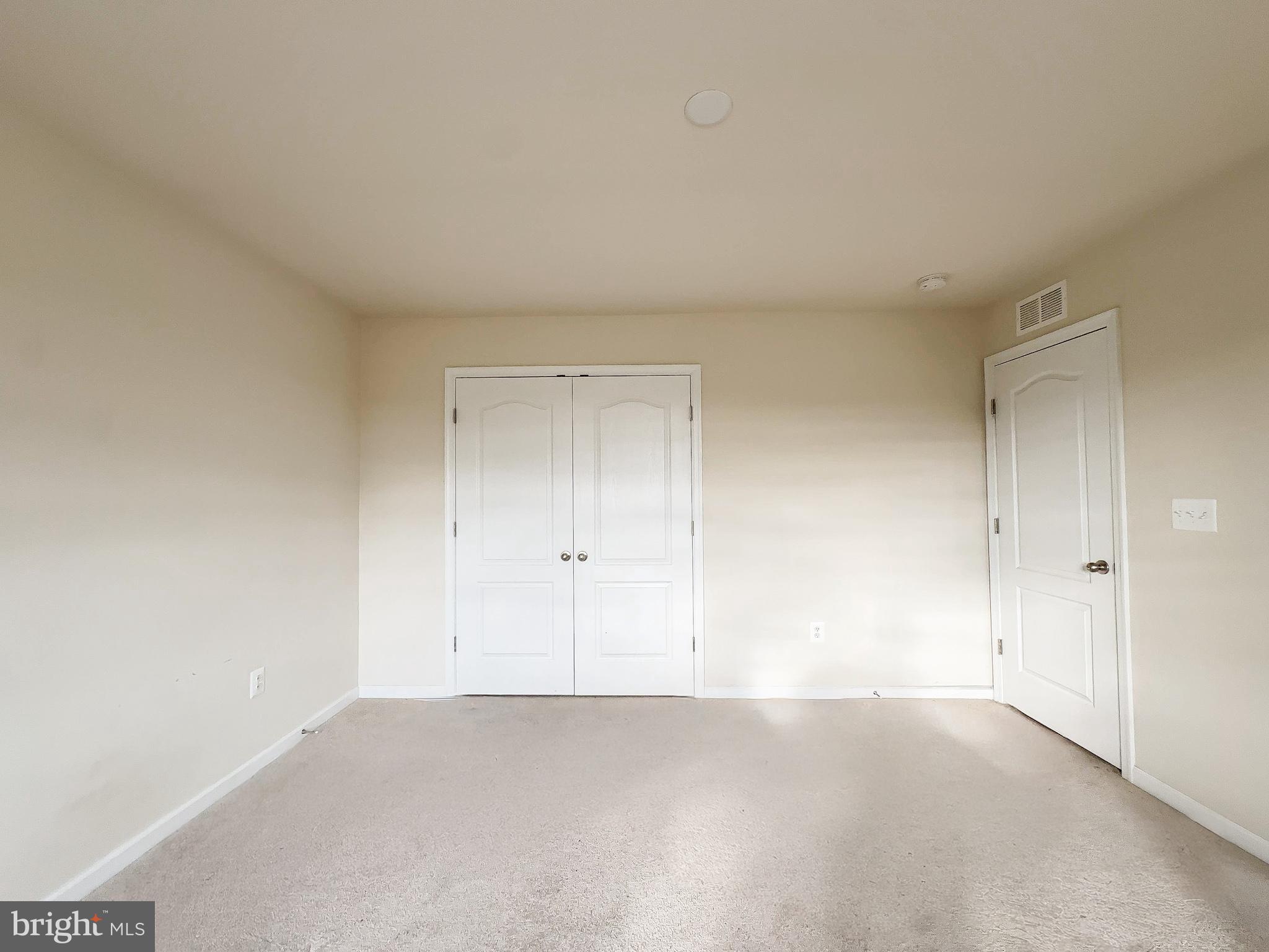10202 Galaxy View Lane Lanham, MD 20706 - Photo 52 of 67 a view of an empty room and a window