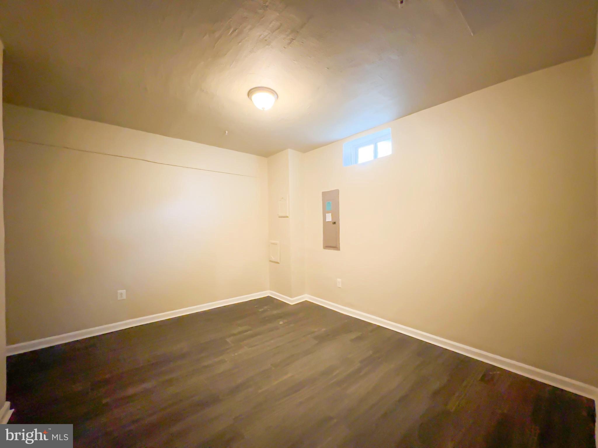 10202 Galaxy View Lane Lanham, MD 20706 - Photo 61 of 67 an empty room with wooden floor and windows