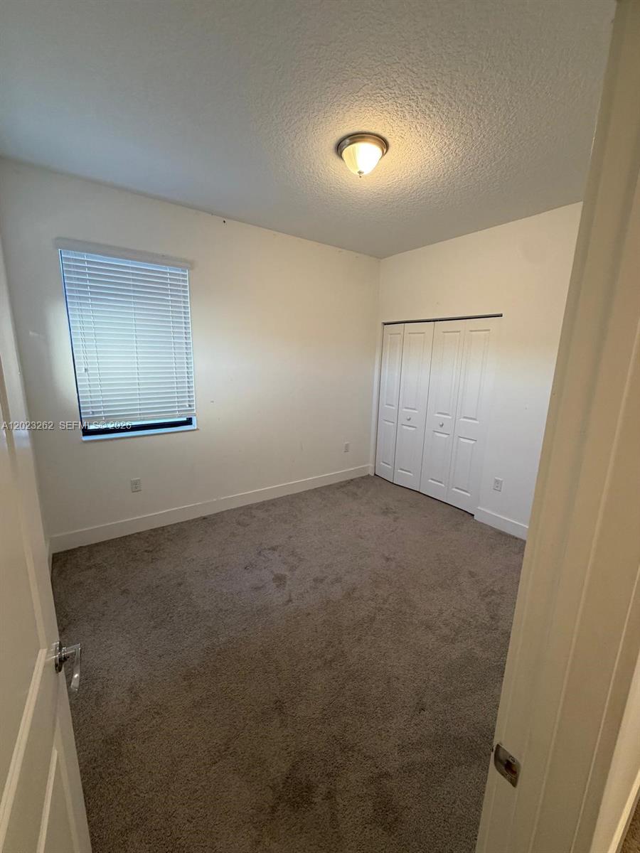 5669 Cerva Lane, Unit 5669 Immokalee, FL 34142 - Photo 17 of 32 an empty room with a bathroom