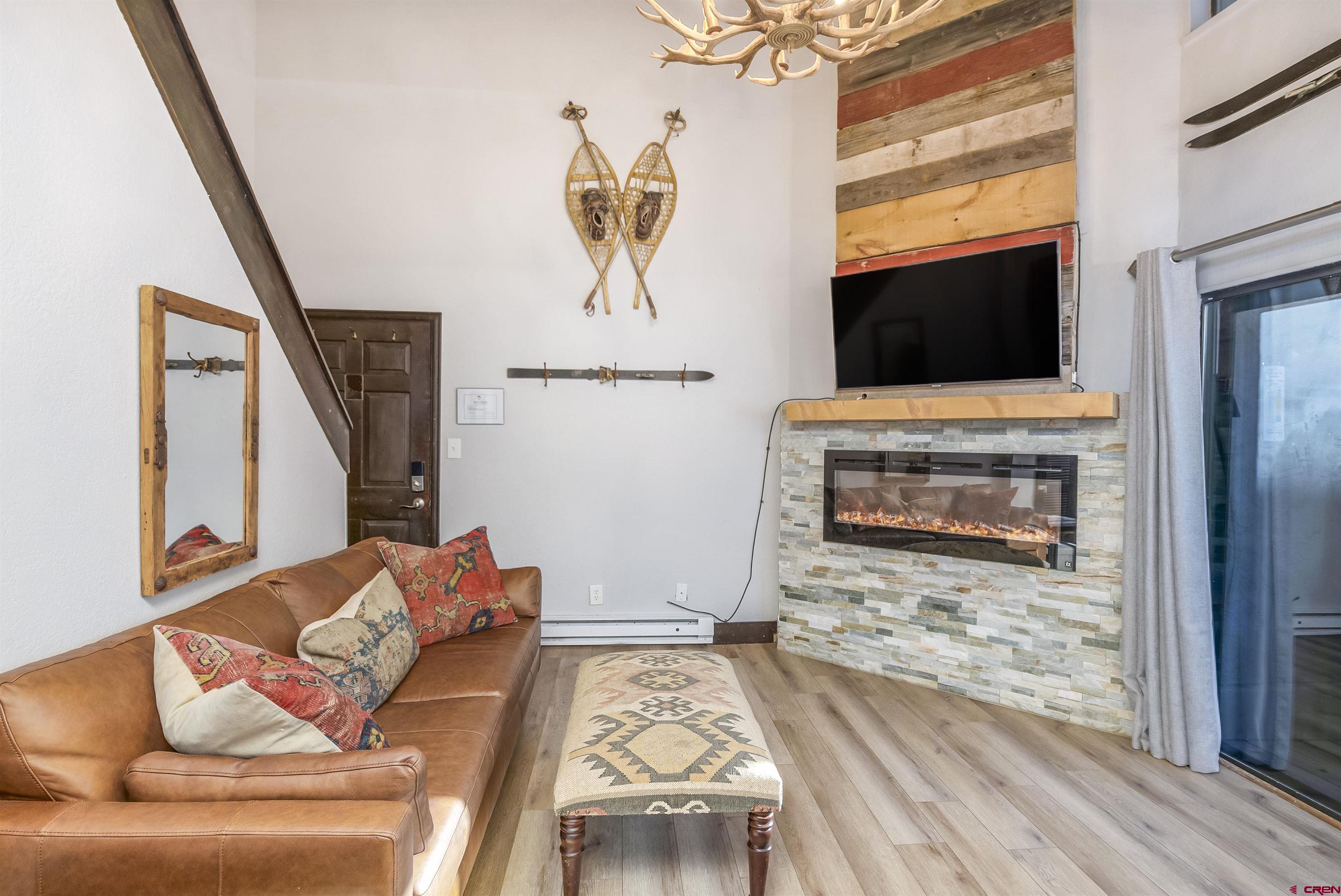 11 Emmons Road, Unit 430 Crested Butte, CO 81225 - Photo 14 of 27 a living room with furniture and a fireplace