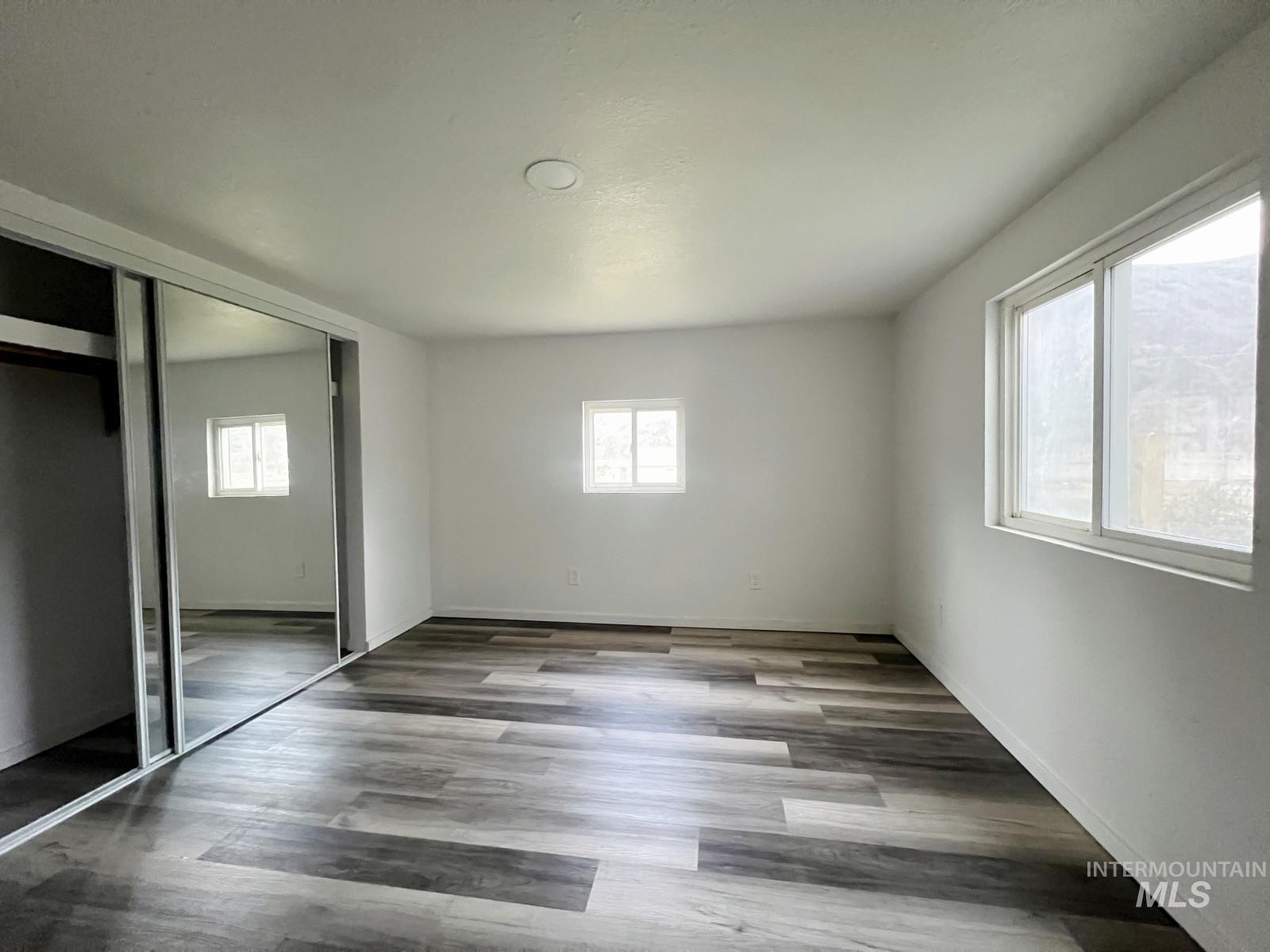 614 Pine Avenue Kooskia, ID 83539 - Photo 11 of 27 Unfurnished bedroom with a closet and wood finished floors