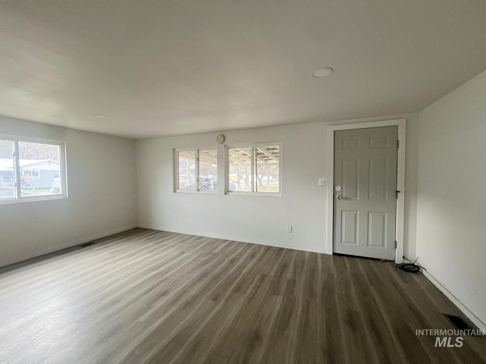614 Pine Avenue Kooskia, ID 83539 - Photo 3 of 27 Spare room with wood finished floors and healthy amount of natural light