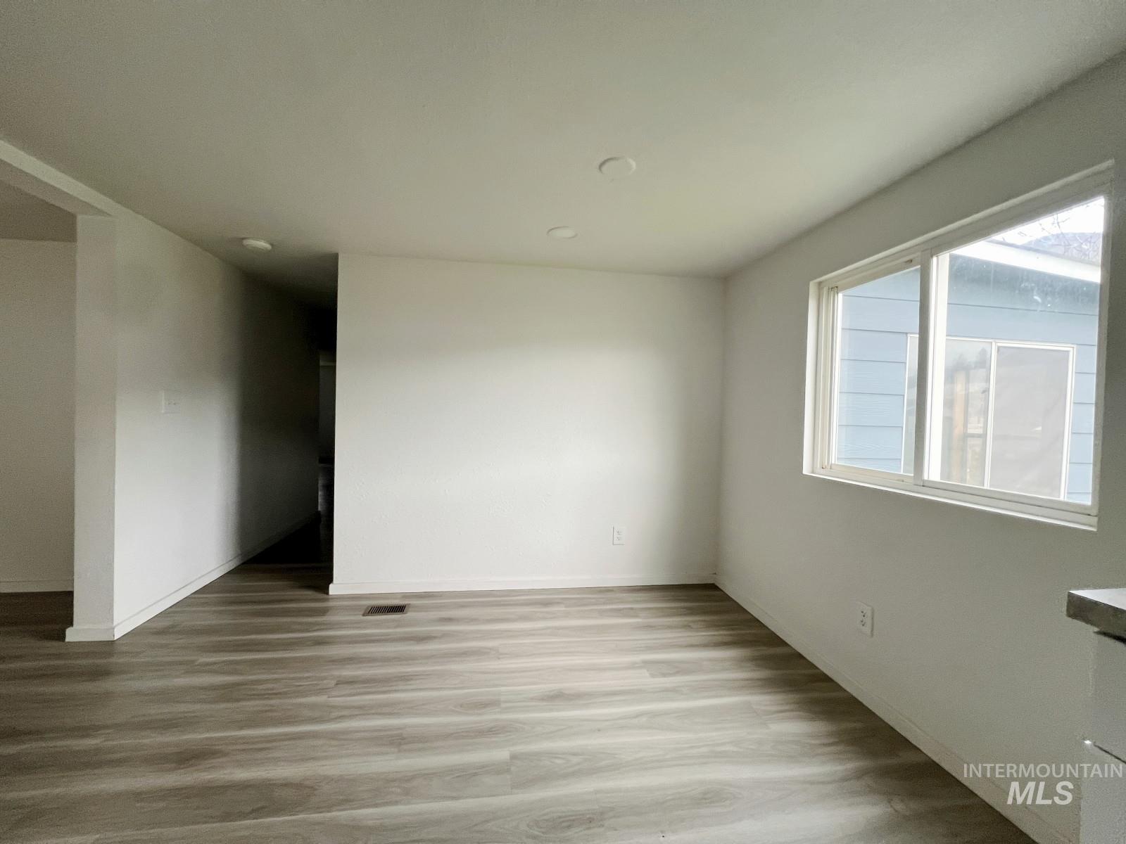 614 Pine Avenue Kooskia, ID 83539 - Photo 6 of 27 Unfurnished room with wood finished floors and baseboards