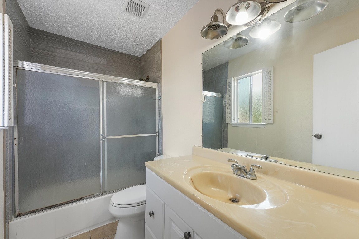 9221 Imogene Street, Unit 9221 Houston, TX 77036 - Photo 6 of 19 a bathroom with a sink toilet and shower