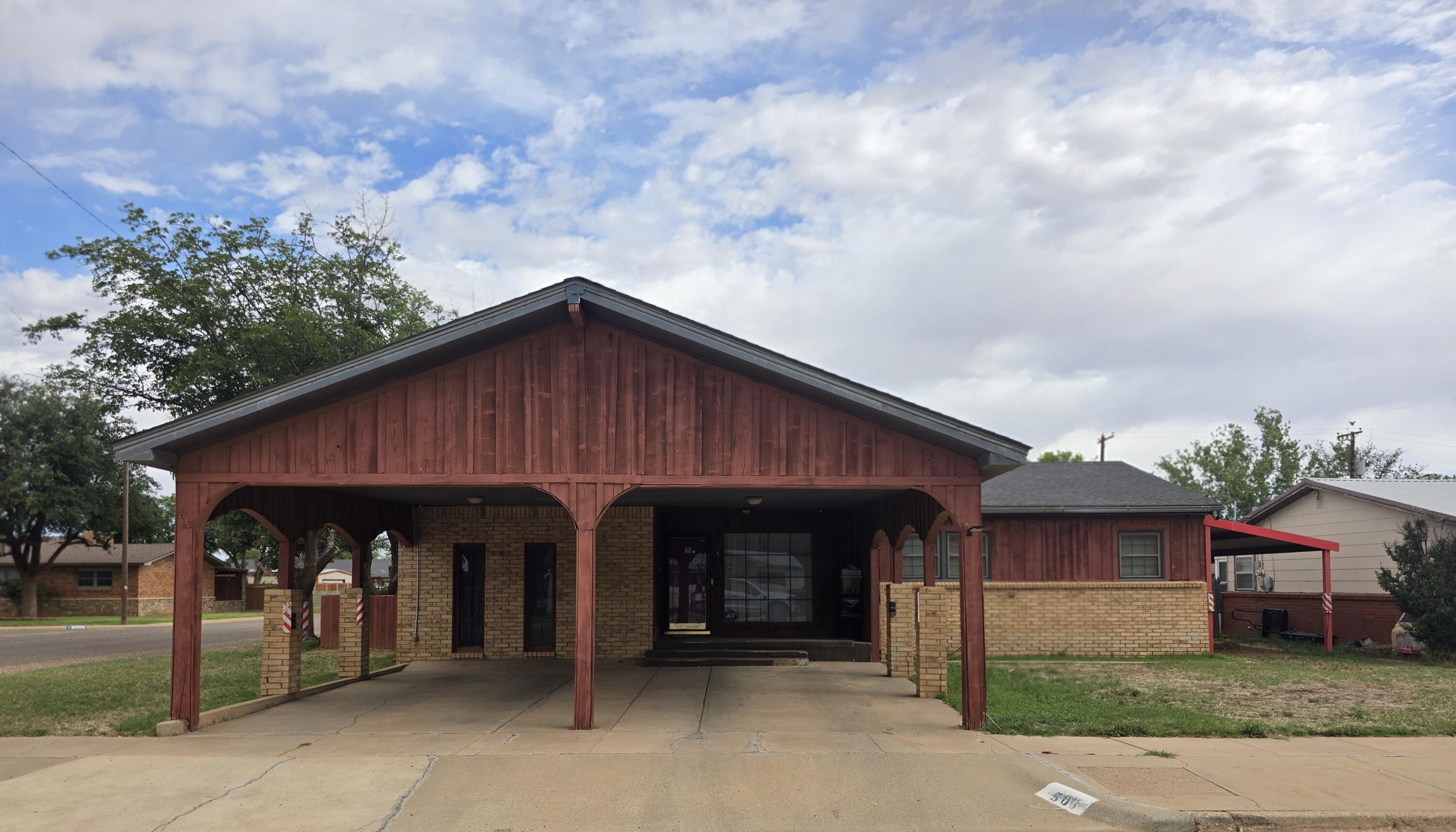 506 North 19th Street Lamesa, TX 79331 - Photo 1 of 29 a front view of a house with garage