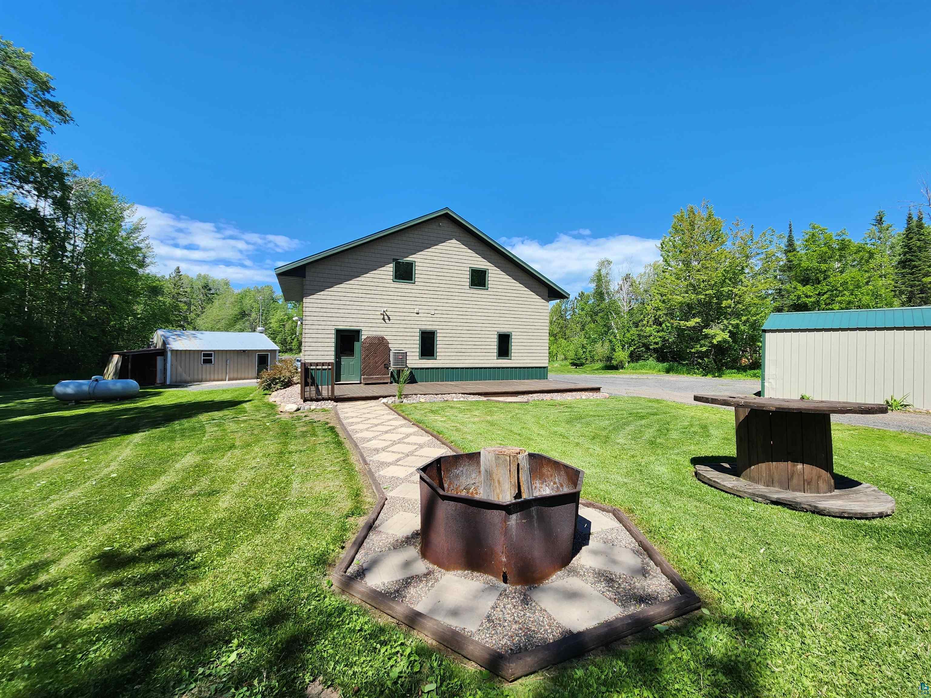 21695 State Highway 13 Cornucopia, WI 54827 - Photo 2 of 33 Complete with firepit, two additional storage sheds, and grilling area with back porch