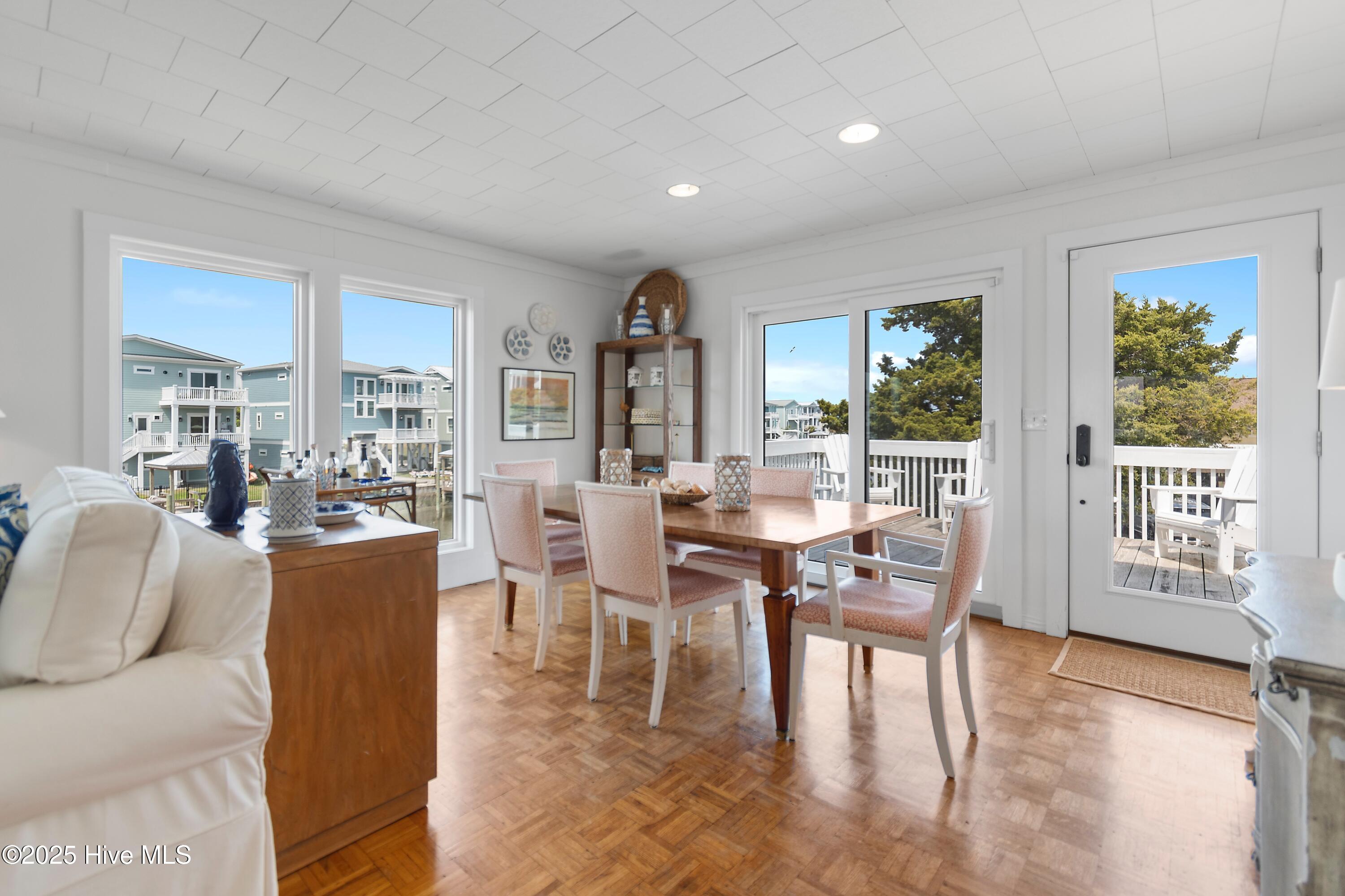 402 Dolphin Street Sunset Beach, NC 28468 - Photo 16 of 53 Lots of Glass highlight views