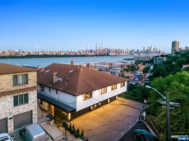 a view of a balcony with two chairs and a table