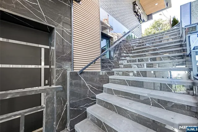 a view of entryway with a front door