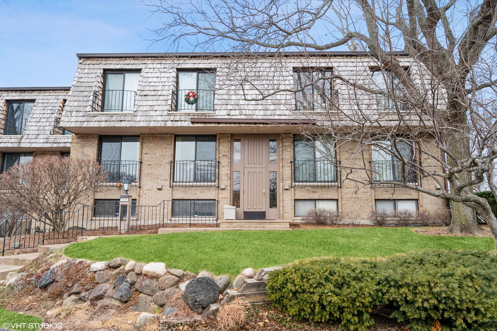 Undisclosed Address Northfield, IL 60093 - Photo 1 of 10 a view of a house with a yard and plants