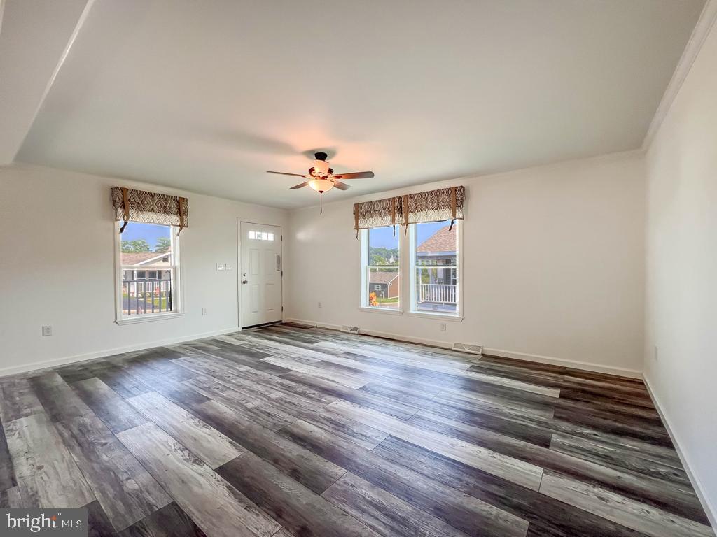 141 Minch Road Parkesburg, PA 19365 - Photo 11 of 34 wooden floor in an empty room with a window