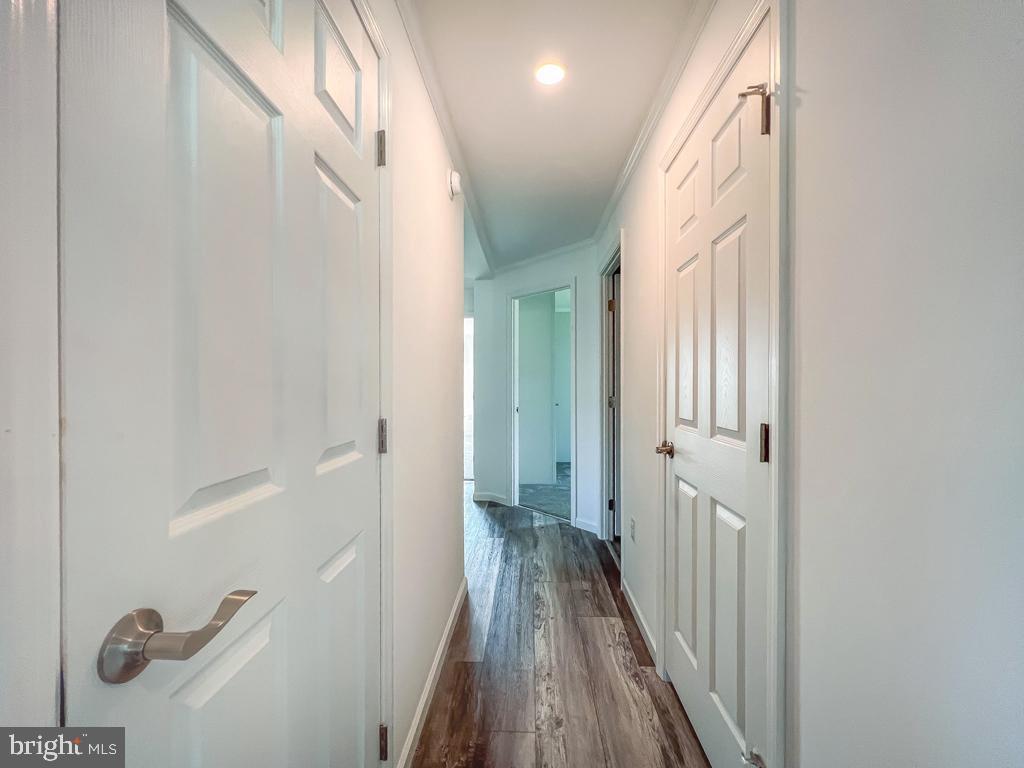 141 Minch Road Parkesburg, PA 19365 - Photo 22 of 34 a view of a hallway with wooden floor and staircase