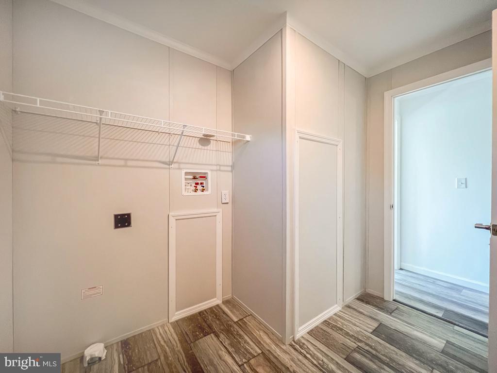 141 Minch Road Parkesburg, PA 19365 - Photo 24 of 34 a view of a storage & utility room with closet wooden floor and windows