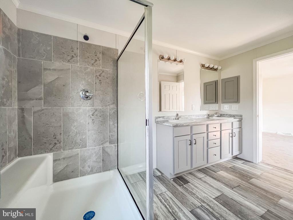 141 Minch Road Parkesburg, PA 19365 - Photo 26 of 34 a bathroom with a tub sink shower and mirror