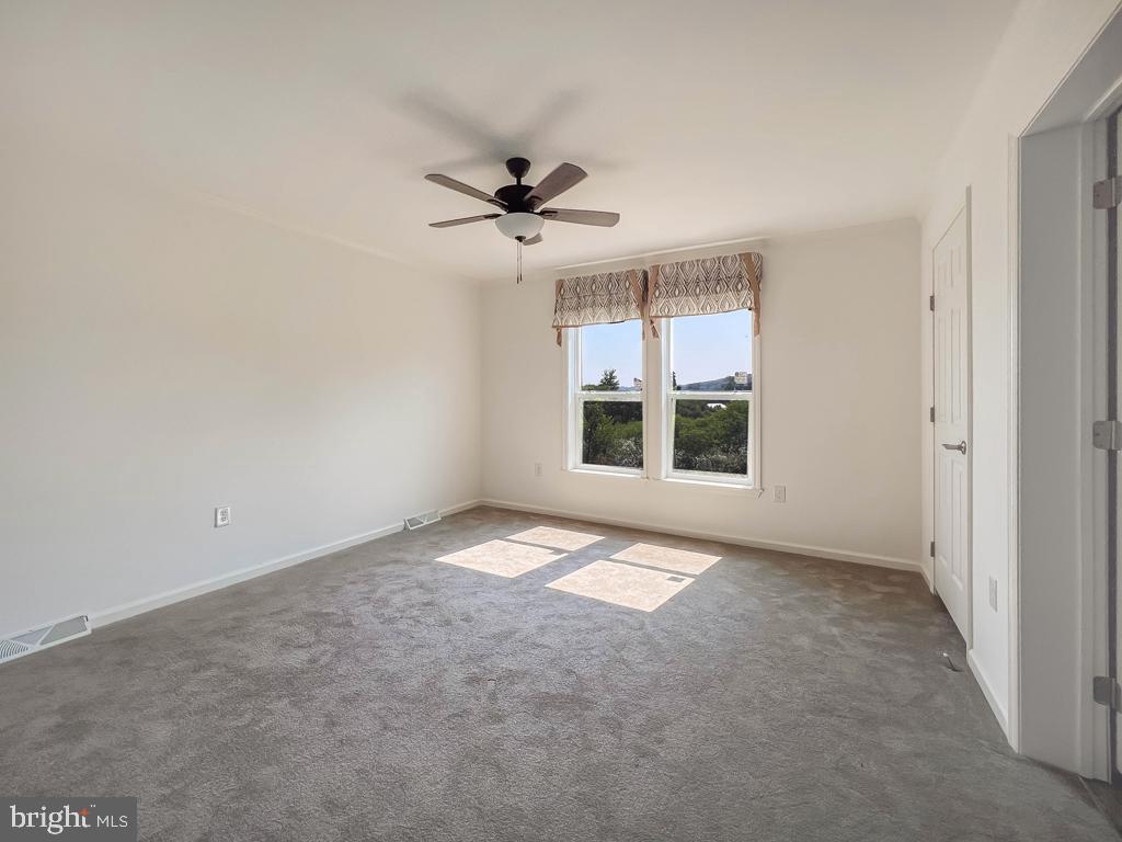 141 Minch Road Parkesburg, PA 19365 - Photo 28 of 34 a view of an empty room with a window