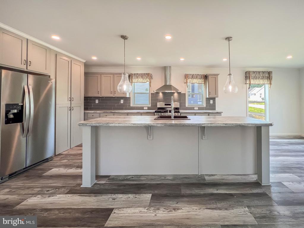 141 Minch Road Parkesburg, PA 19365 - Photo 3 of 34 a large kitchen with stainless steel appliances kitchen island granite countertop a refrigerator a stove a sink and a oven