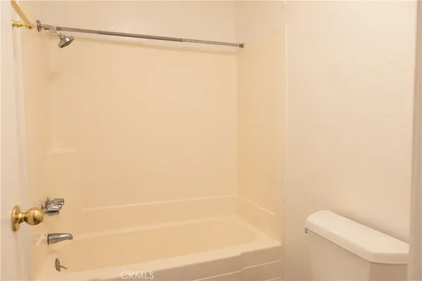 a bathroom with a shower and a toilet