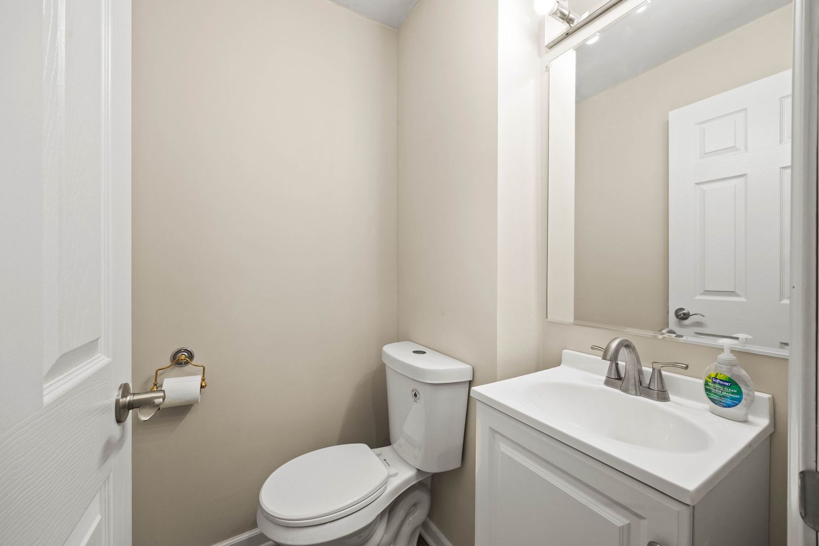 246 Miller Avenue DeKalb, IL 60115 - Photo 17 of 36 a bathroom with a sink a toilet and a mirror