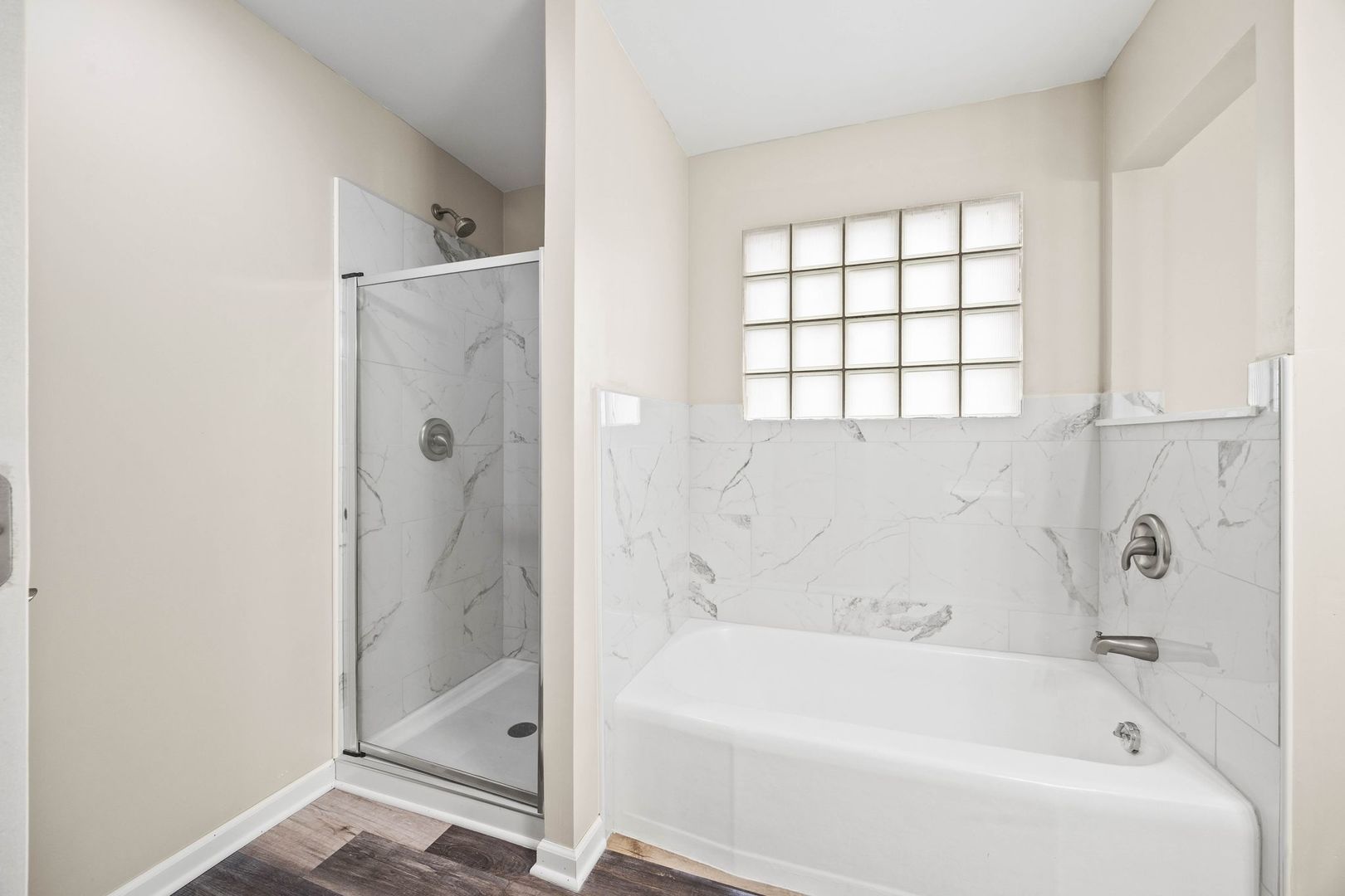 246 Miller Avenue DeKalb, IL 60115 - Photo 18 of 36 a white bath tub sitting next to a shower