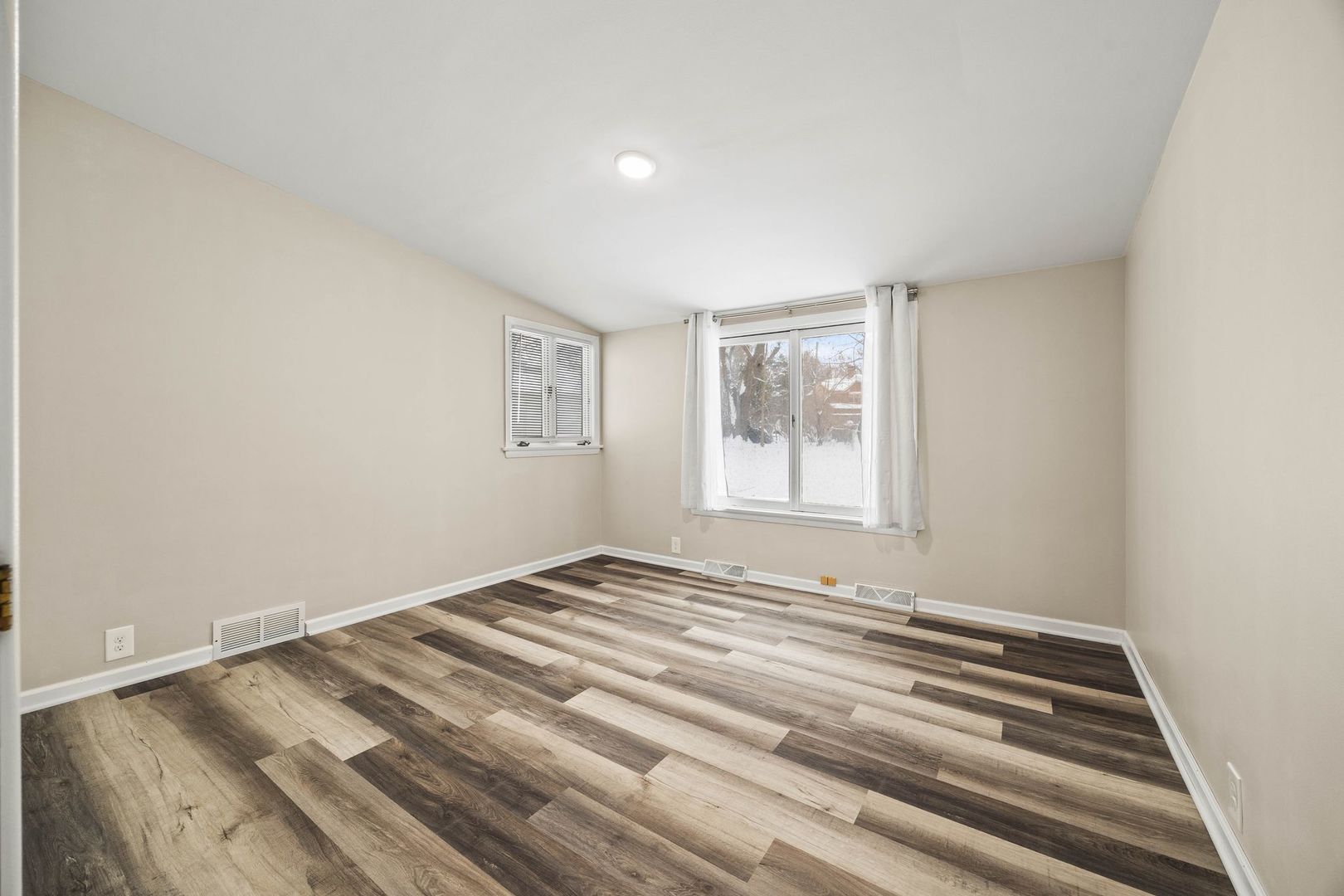 246 Miller Avenue DeKalb, IL 60115 - Photo 22 of 36 a view of a room with wooden floor and window