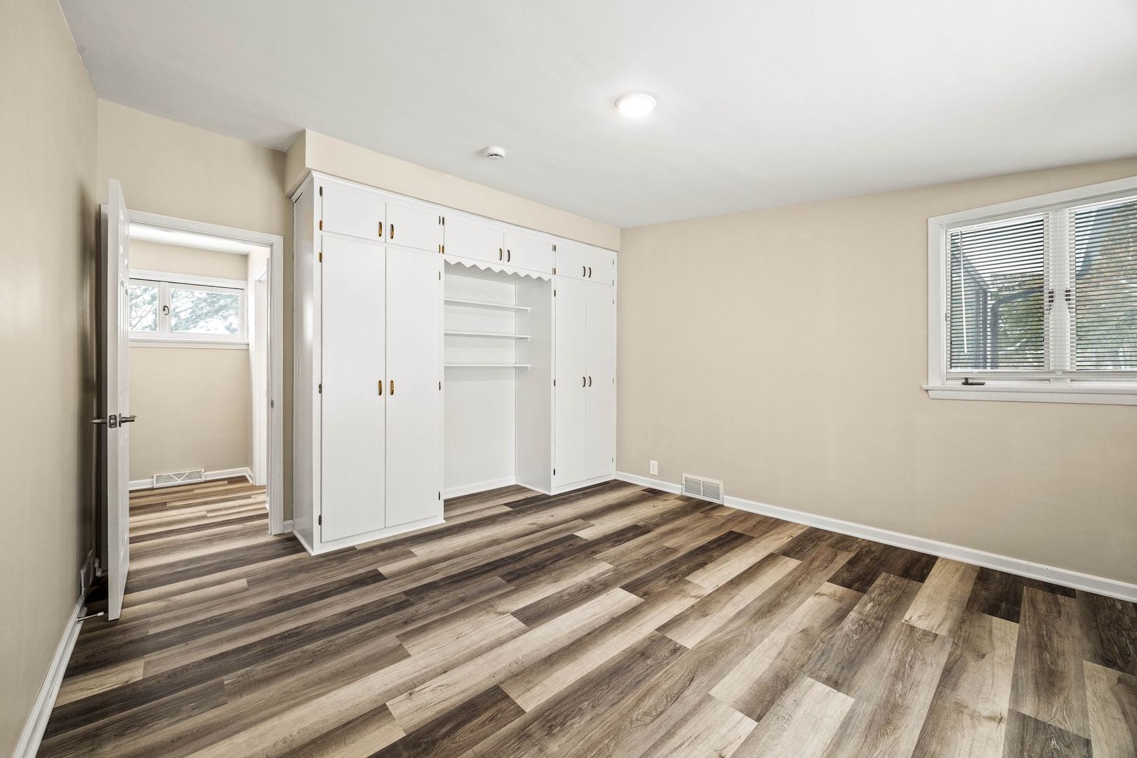 246 Miller Avenue DeKalb, IL 60115 - Photo 23 of 36 a view of a room with wooden floor and cabinet