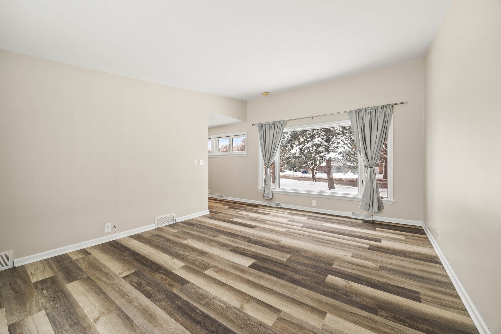 246 Miller Avenue DeKalb, IL 60115 - Photo 25 of 36 a view of a room with wooden floor and window