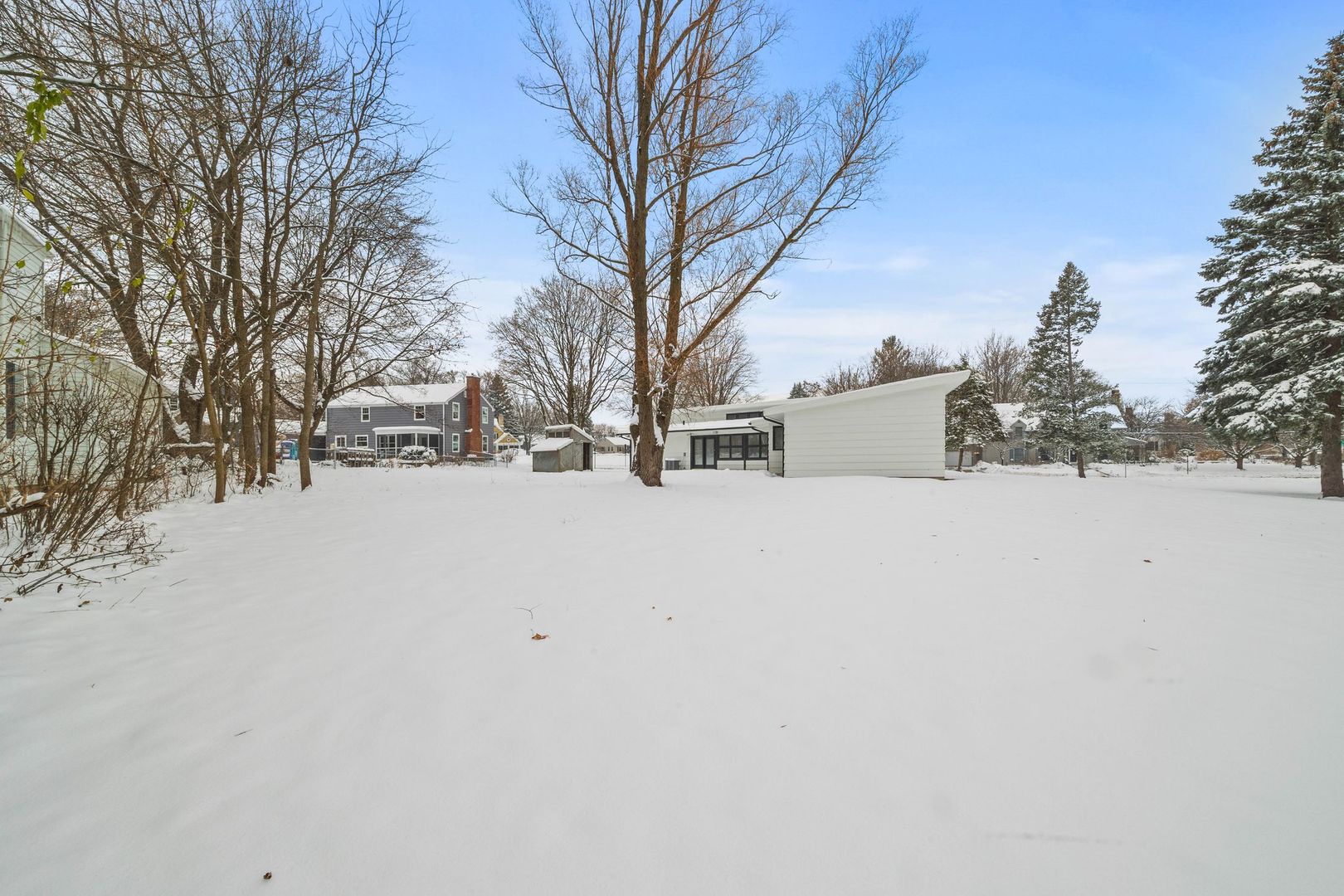 246 Miller Avenue DeKalb, IL 60115 - Photo 33 of 36 a street view covered with snow