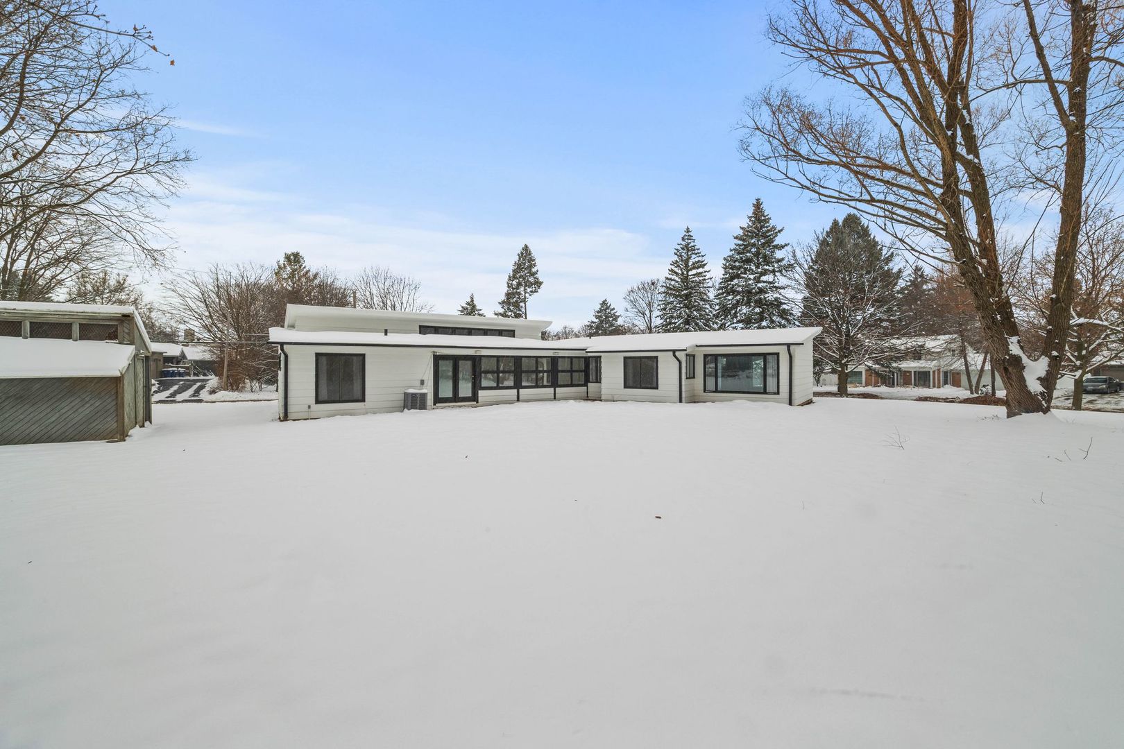 246 Miller Avenue DeKalb, IL 60115 - Photo 34 of 36 a house with trees in the background