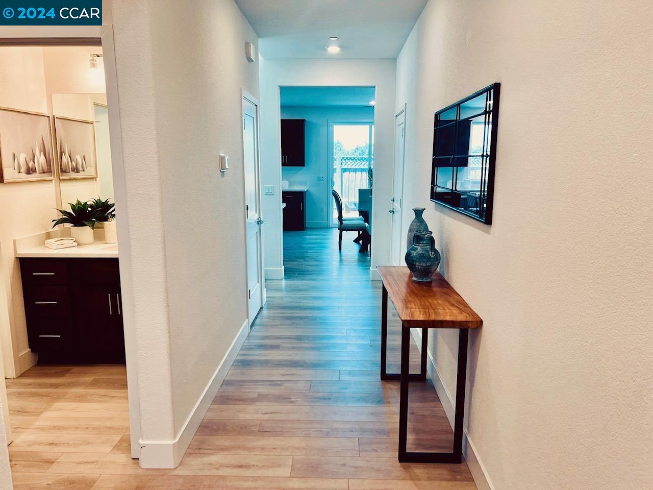 388 Ramos Ranch Road Oakley, CA 94561 - Photo 3 of 21 wooden floor in a hall with a window and wooden floor