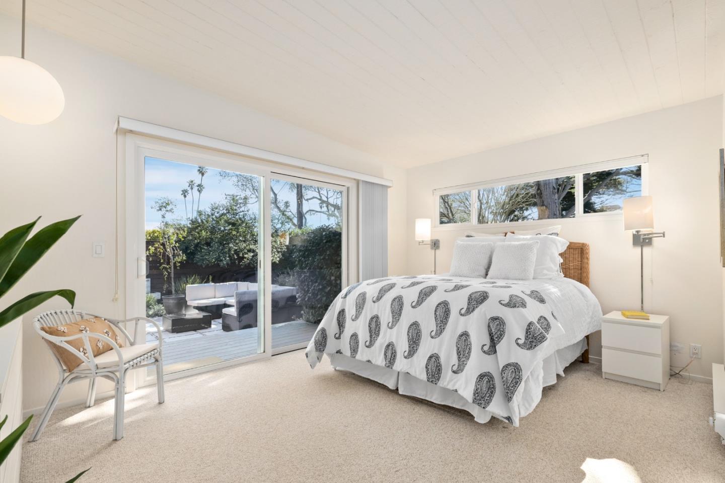 404 Arbolado Drive La Selva Beach, CA 95076 - Photo 11 of 36 a bedroom with a bed and large window