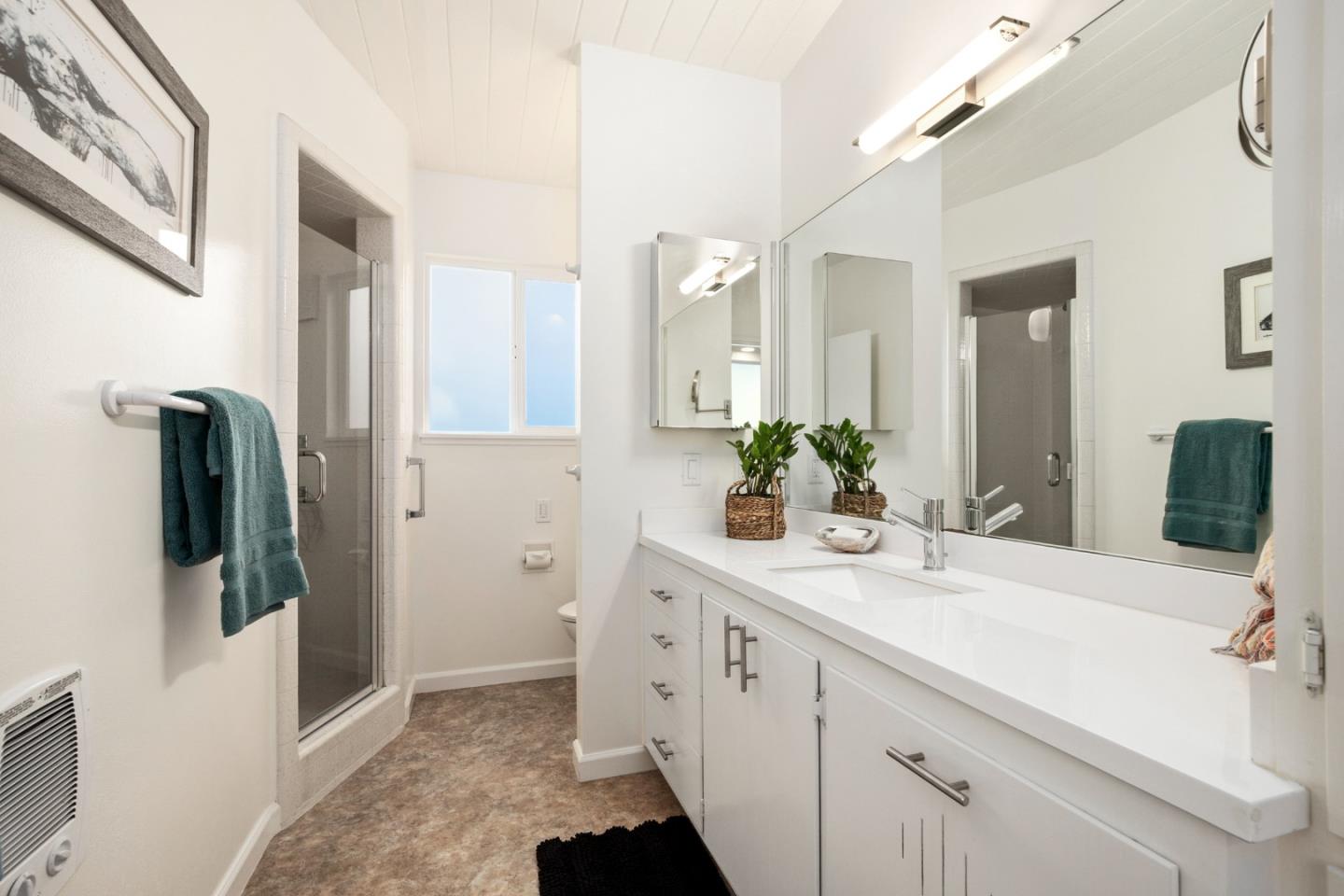 404 Arbolado Drive La Selva Beach, CA 95076 - Photo 17 of 36 a bathroom with a sink and mirror