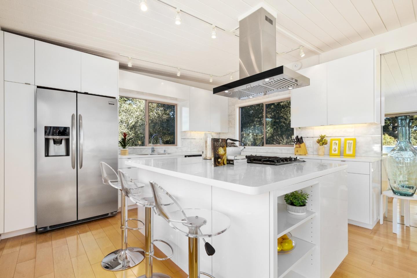 404 Arbolado Drive La Selva Beach, CA 95076 - Photo 34 of 36 a kitchen with stainless steel appliances granite countertop a sink and a refrigerator