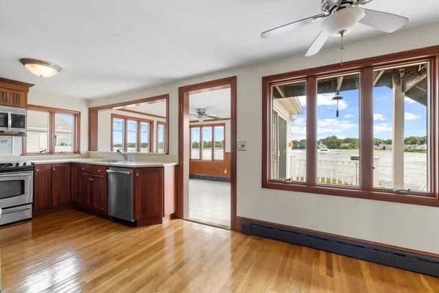 a kitchen with stainless steel appliances granite countertop a refrigerator stove and sink