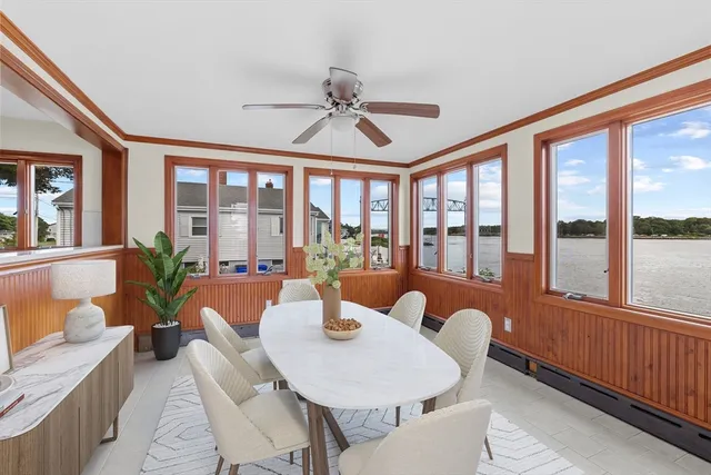 a view of a balcony with a floor to ceiling window with wooden floor