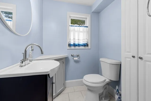 a view of stairs and hall with wooden floor