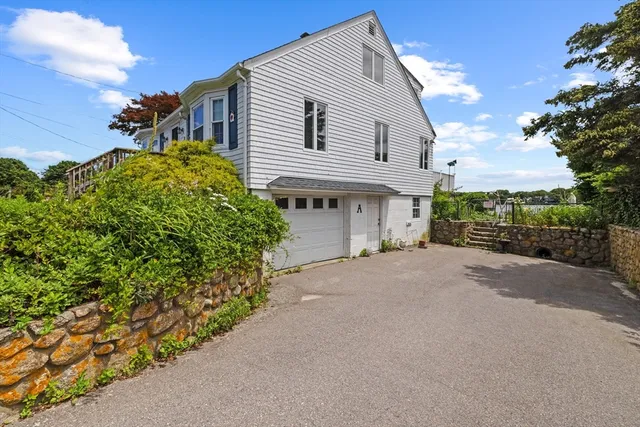 an aerial view of a house with a garden