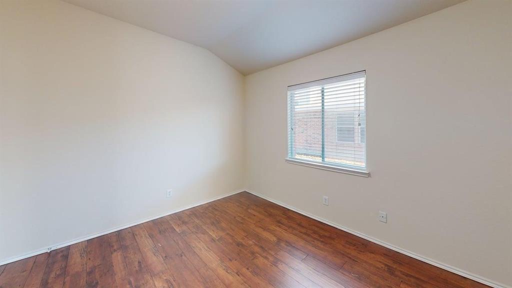 3251 Torio Grand Prairie, TX 75054 - Photo 12 of 23 an empty room with wooden floor and windows