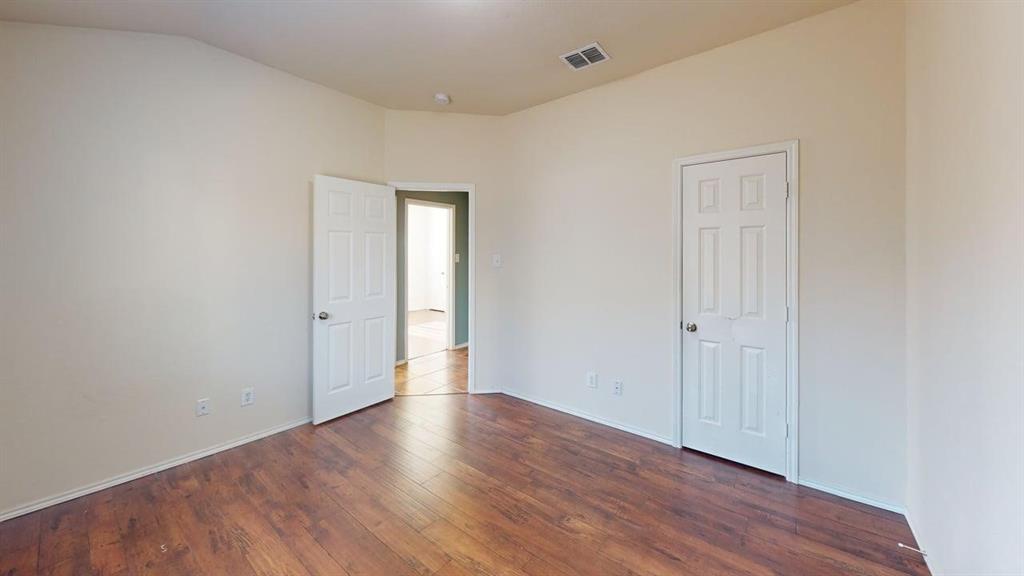 3251 Torio Grand Prairie, TX 75054 - Photo 13 of 23 a view of an empty room with wooden floor