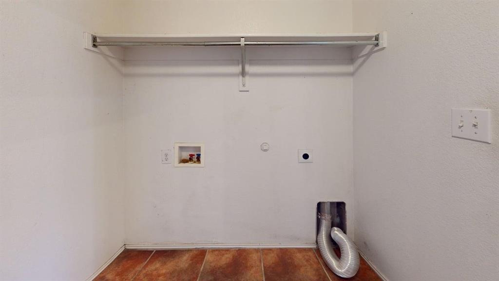 3251 Torio Grand Prairie, TX 75054 - Photo 20 of 23 a view of a small space with racks on the wall