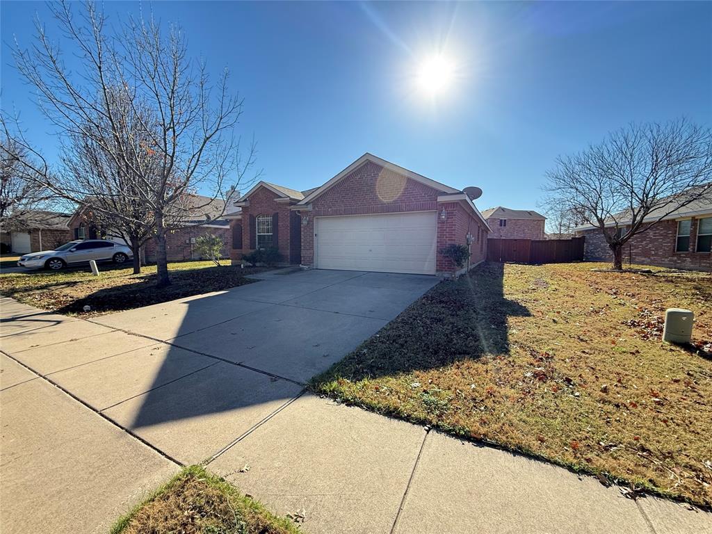 3251 Torio Grand Prairie, TX 75054 - Photo 2 of 23 a view of a yard with a large tree